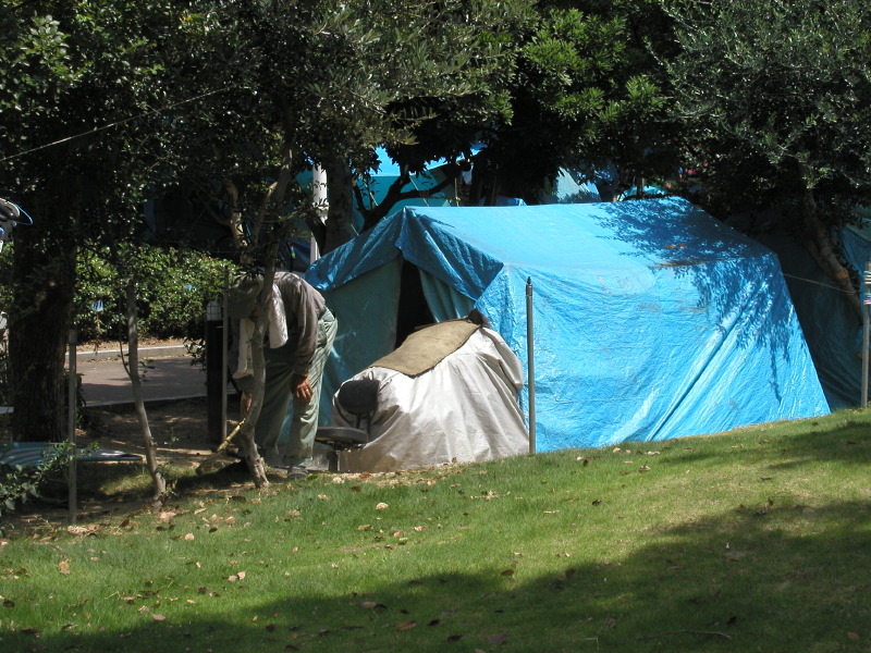 Homeless man cleaning his place, Kobe