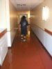 Avi walking down flooded hallway