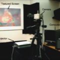 A Projection System with Radiometric Compensation for Screen Imperfections