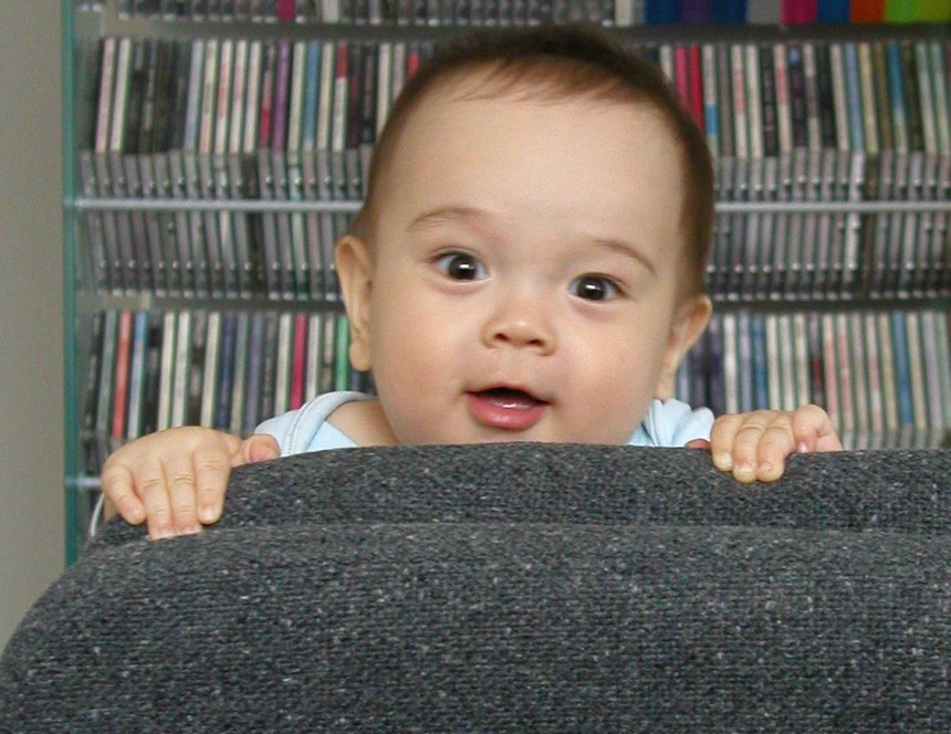 20040425-1047 Kyle peeking over chair back