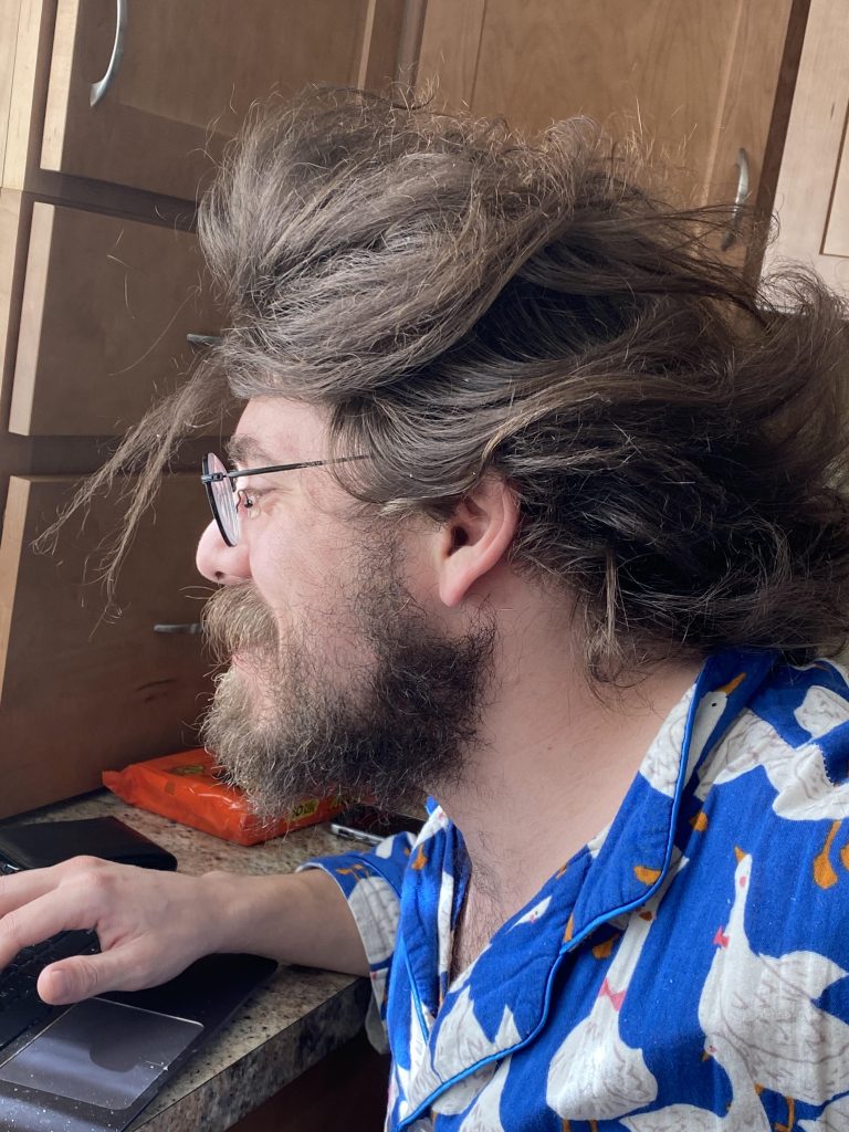 Charles Baird coding in the kitchen.