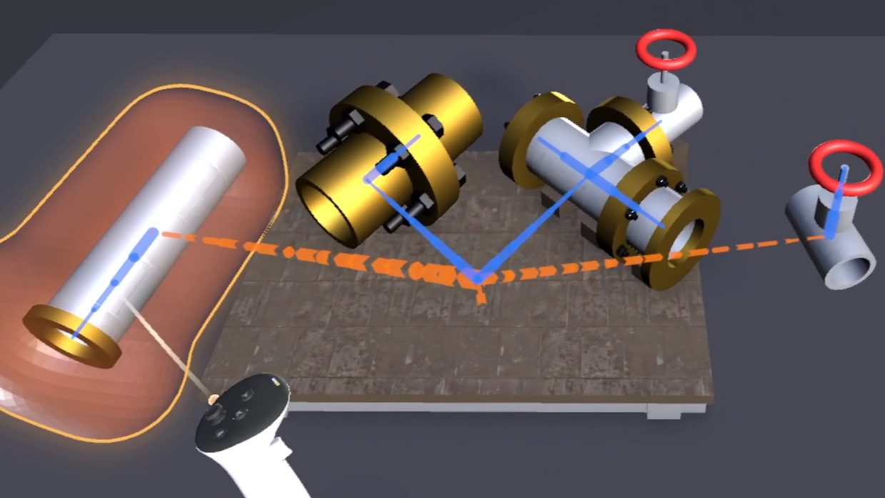 VR view of four pipe parts staged on a wooden pallet. Solid blue lines run from the pallet to a brass flanged pipe and a T-pipe, dashed orange lines run to a gray pipe and a valve, and a controller points at the gray pipe, which sits inside a glowing orange hull.