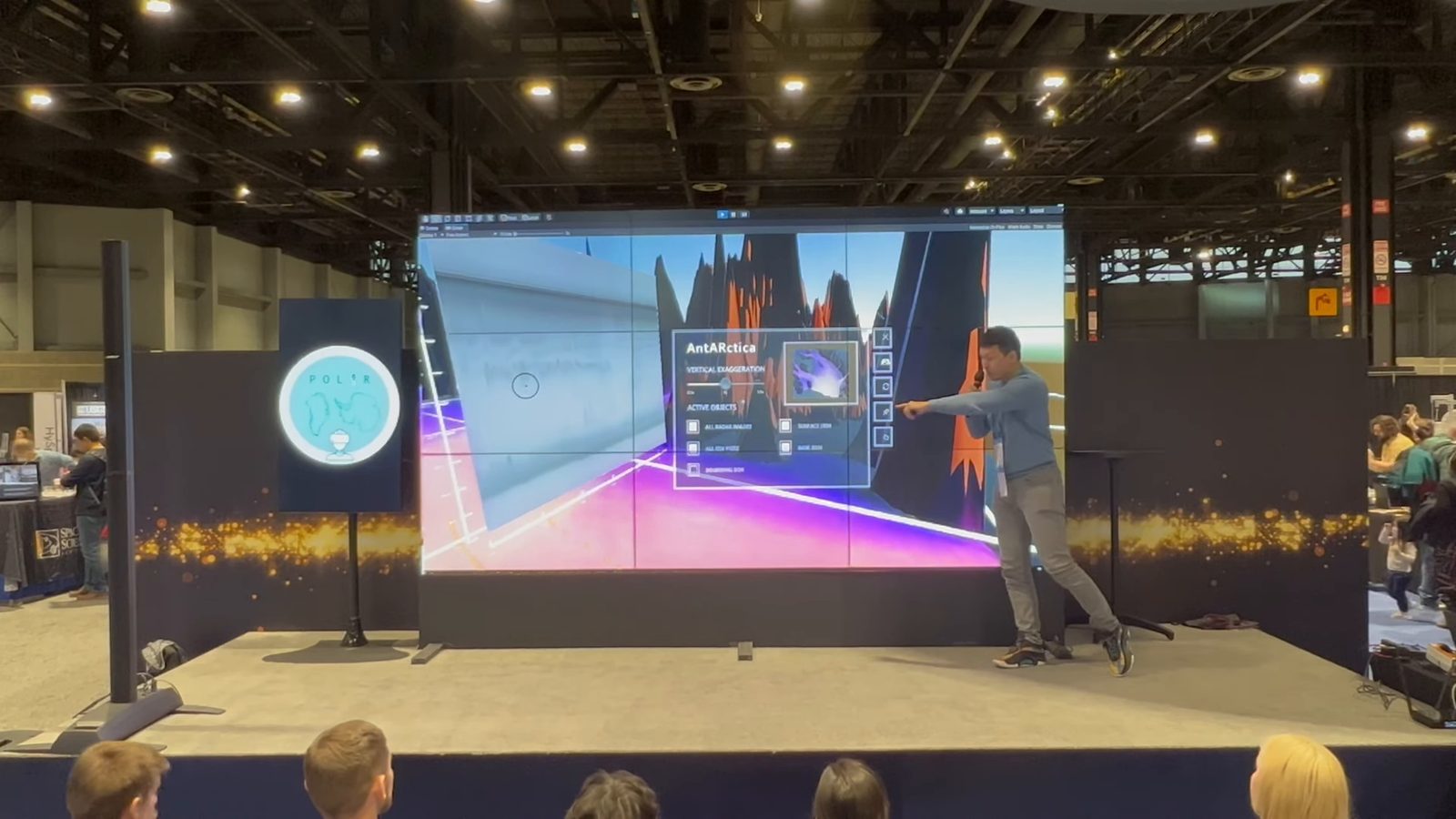 Still from the video: a presenter beside a large video wall showing radar data in 3D. Opens on YouTube.
